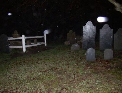 An orb caught at a cemetery- a reflection of the flash or a ghost?